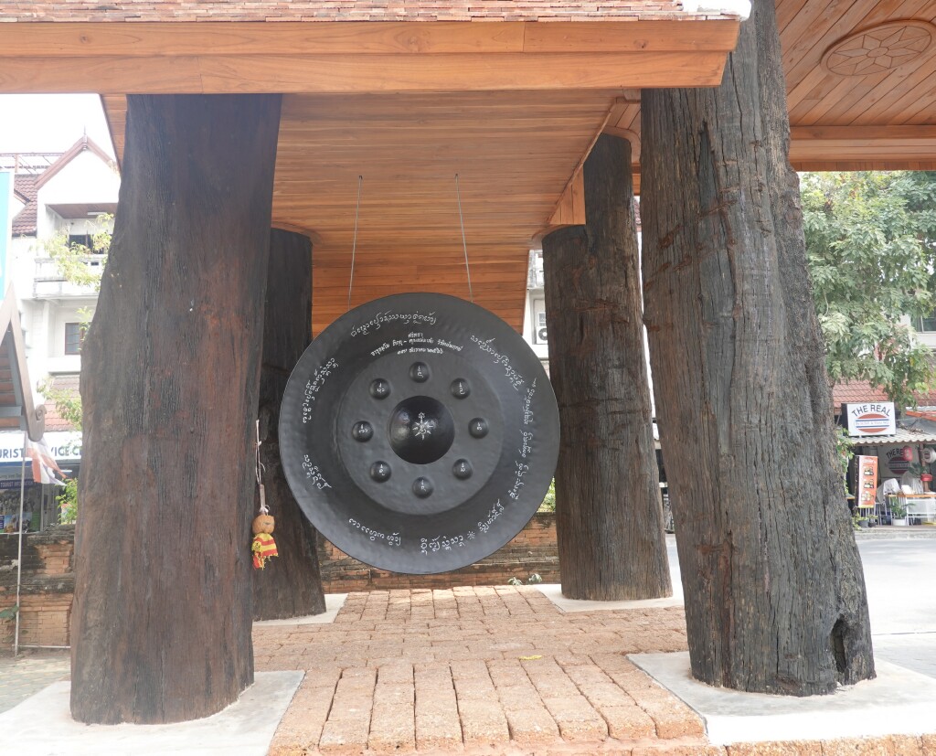 Large black round gong at the entrance at Wat Jed Lin, Chiang Mai, Thailand