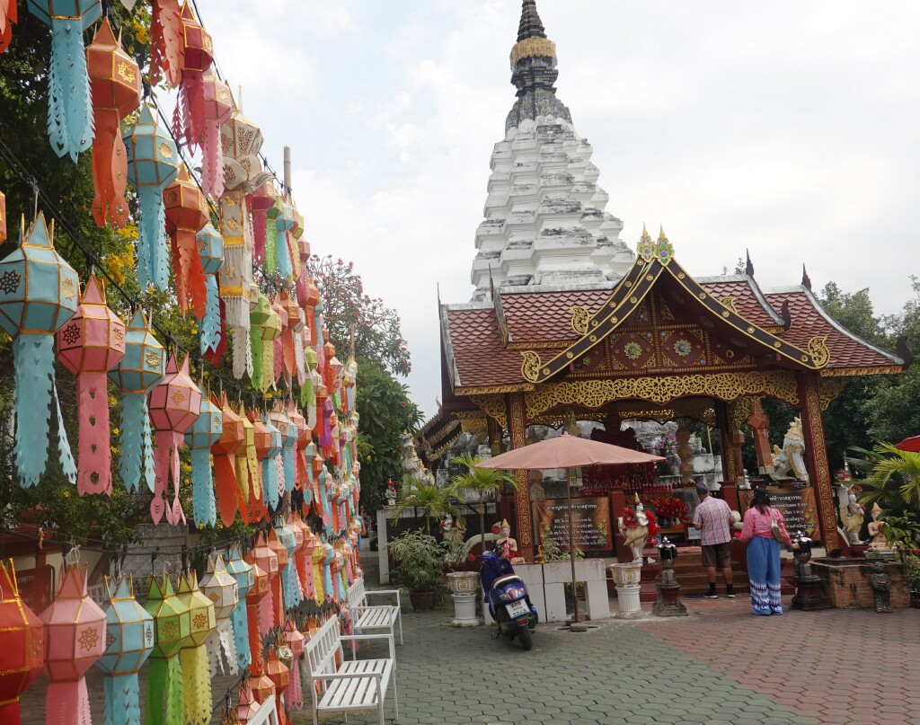 Entrance decorations and view of chedi at Wat Muen Toom, chiang Mai, Thailand
