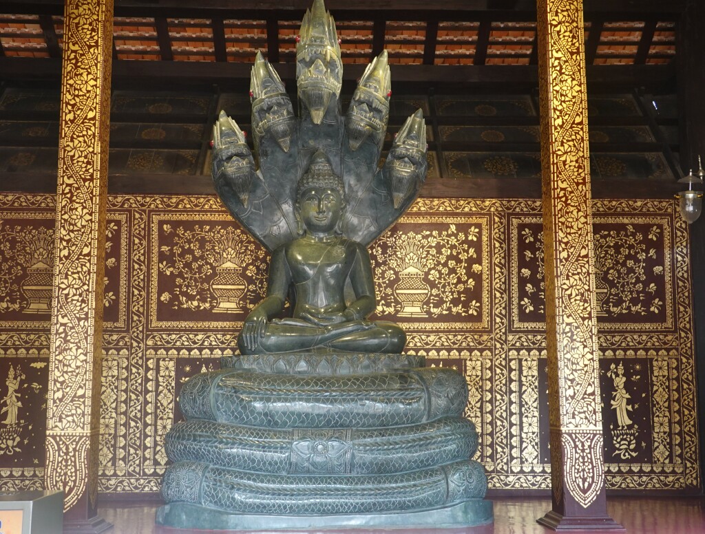 Dark jade-colored Phra Buddharatana-Naganaphisi Buddha image at Wat Chedi Luang, Chiang Mai, Thailand