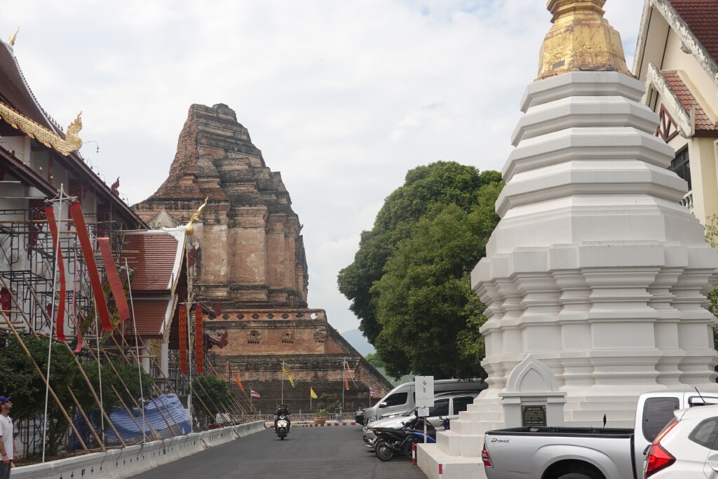 Looking back past north small white chedi and worship hall to the large chedi at Wat Chedi Luang, Chiang Mai, Thailand